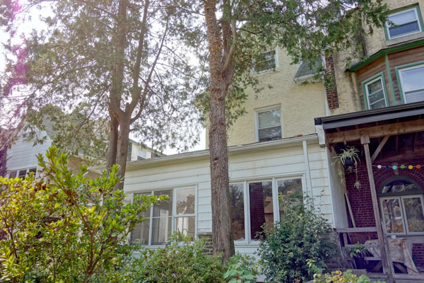 One of Germantown’s favorite blocks.  Residential, quiet, 3-story twin homes built in the early 20th century with character and style.  This home has been lived in by the same family since 1970.  Enormous enclosed wrap-around porch, large sunny rooms, high ceilings, hardwood floors.  1 bedroom apartment on the 3rd floor with separate entrance.  Private back yard.  Prized convenient location.6461603